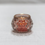 Rose gold candle holder on a white background
