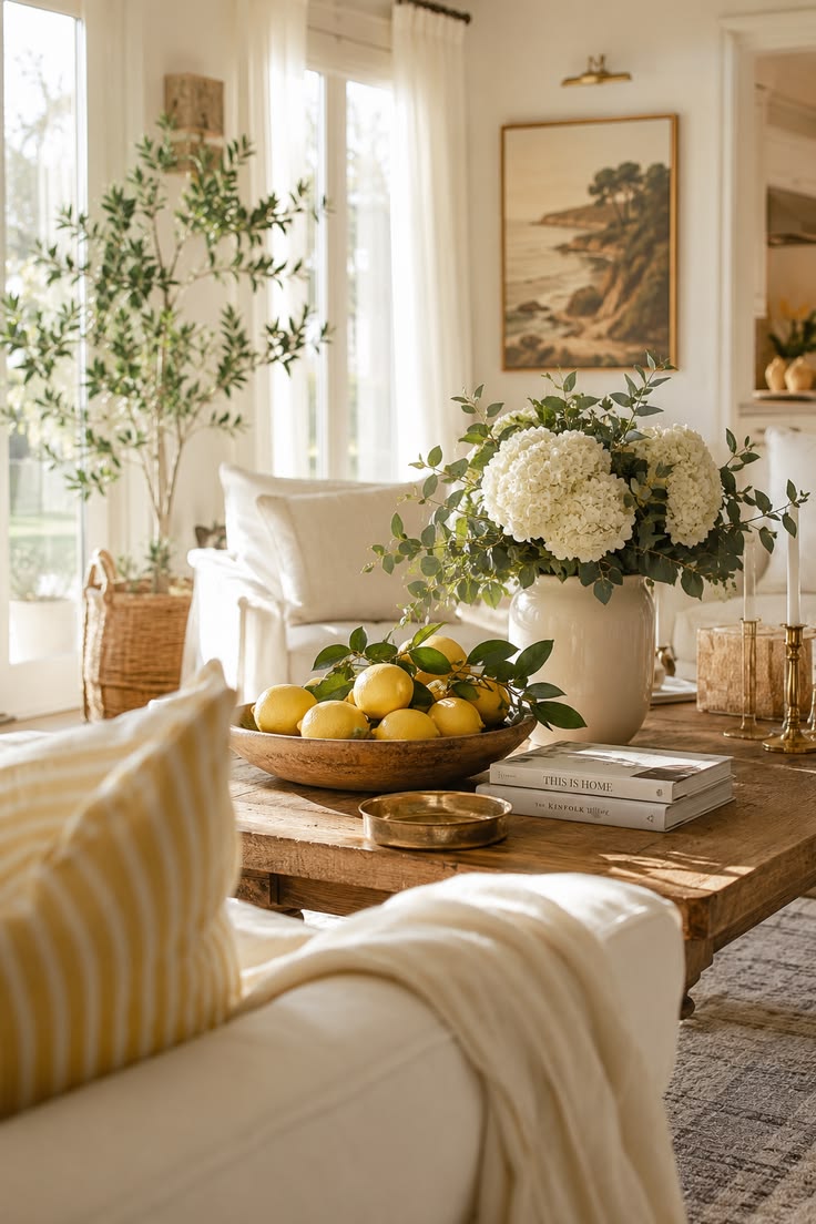 Hydrangeas styled on a sitting room table with candles and home accessories