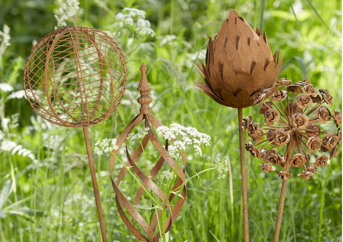 Garden Ornamements in Flower Beds in the garden