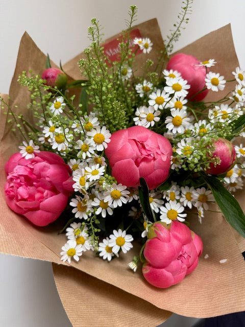 Just because bouquet of peonies and daisy tana wrapped in kraft paper
