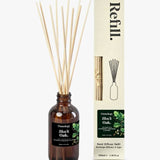Luxury reed diffuser refill styled with reeds and home decor warm amber fragrance