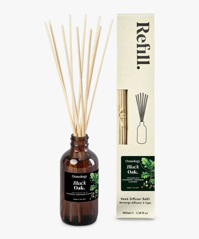 Luxury reed diffuser refill styled with reeds and home decor warm amber fragrance