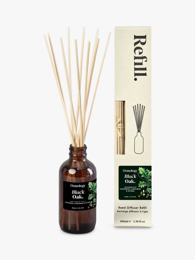 Luxury reed diffuser refill styled with reeds and home decor warm amber fragrance
