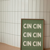 Print sign with 'CIN CIN' text on against a tiled wall
