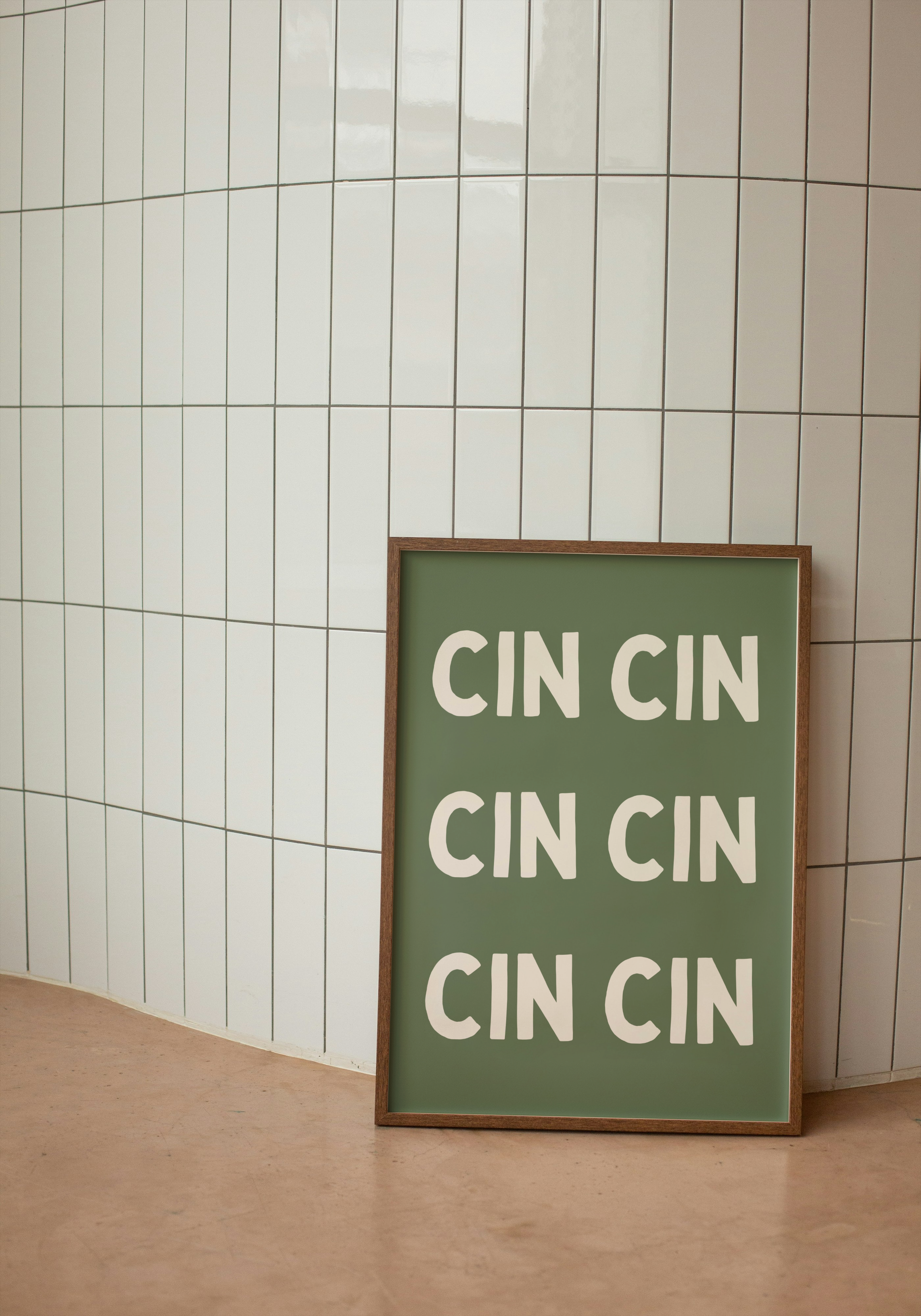 Print sign with 'CIN CIN' text on against a tiled wall
