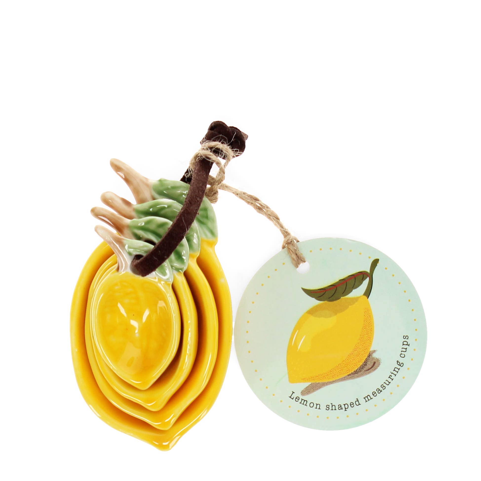 Set of 4 ceramic measuring spoons with decorative lemon design in yellow, green and brown, stacked together with fabric tie for baking and kitchen use.