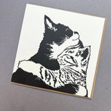 Penguin Ink Cuddle Time letterpress greeting card featuring two cuddling kittens, printed on 100% recycled board with a tactile embossed finish.
