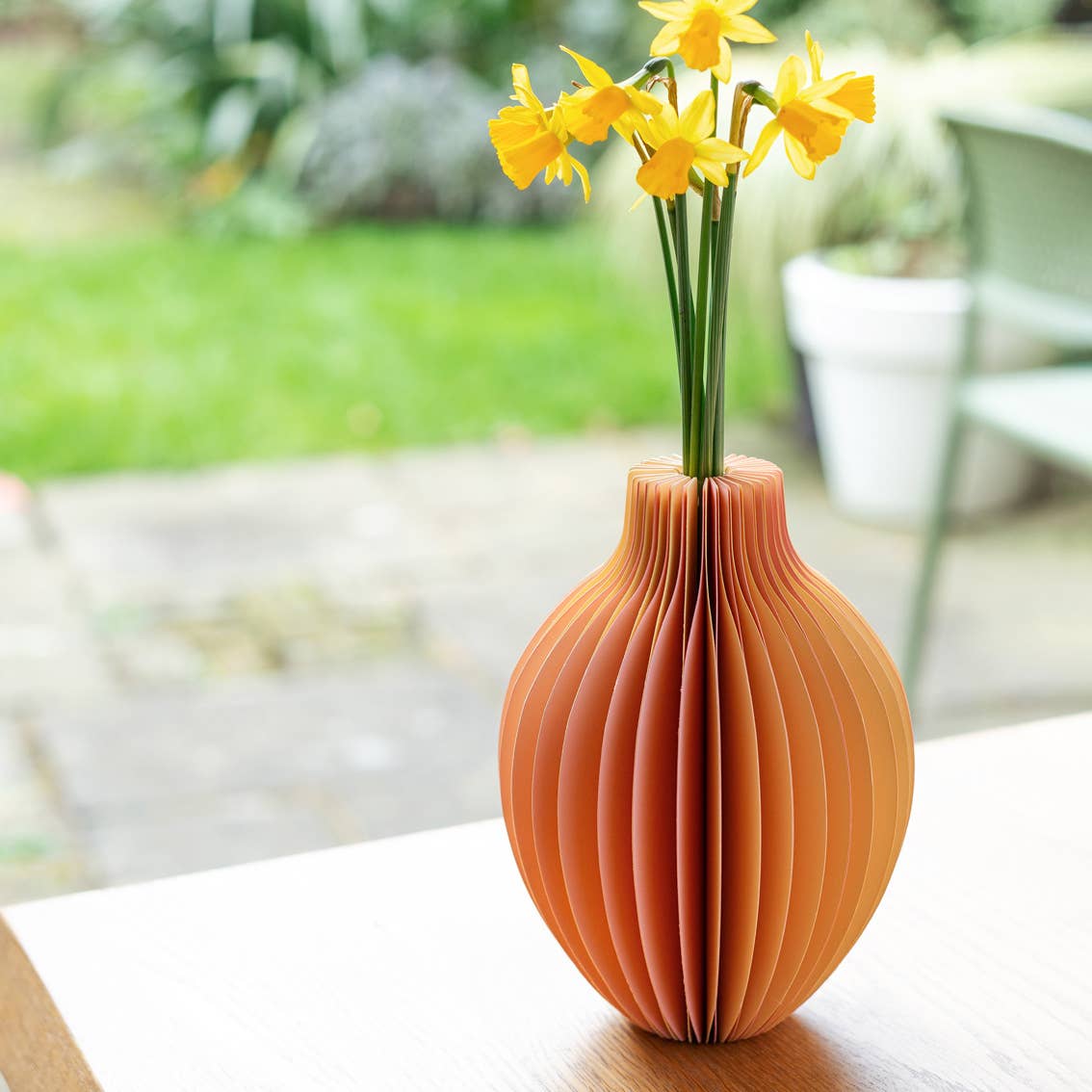 Mellow Yellow honeycomb paper vase with pastel yellow and pink honeycomb design and glass flower vial