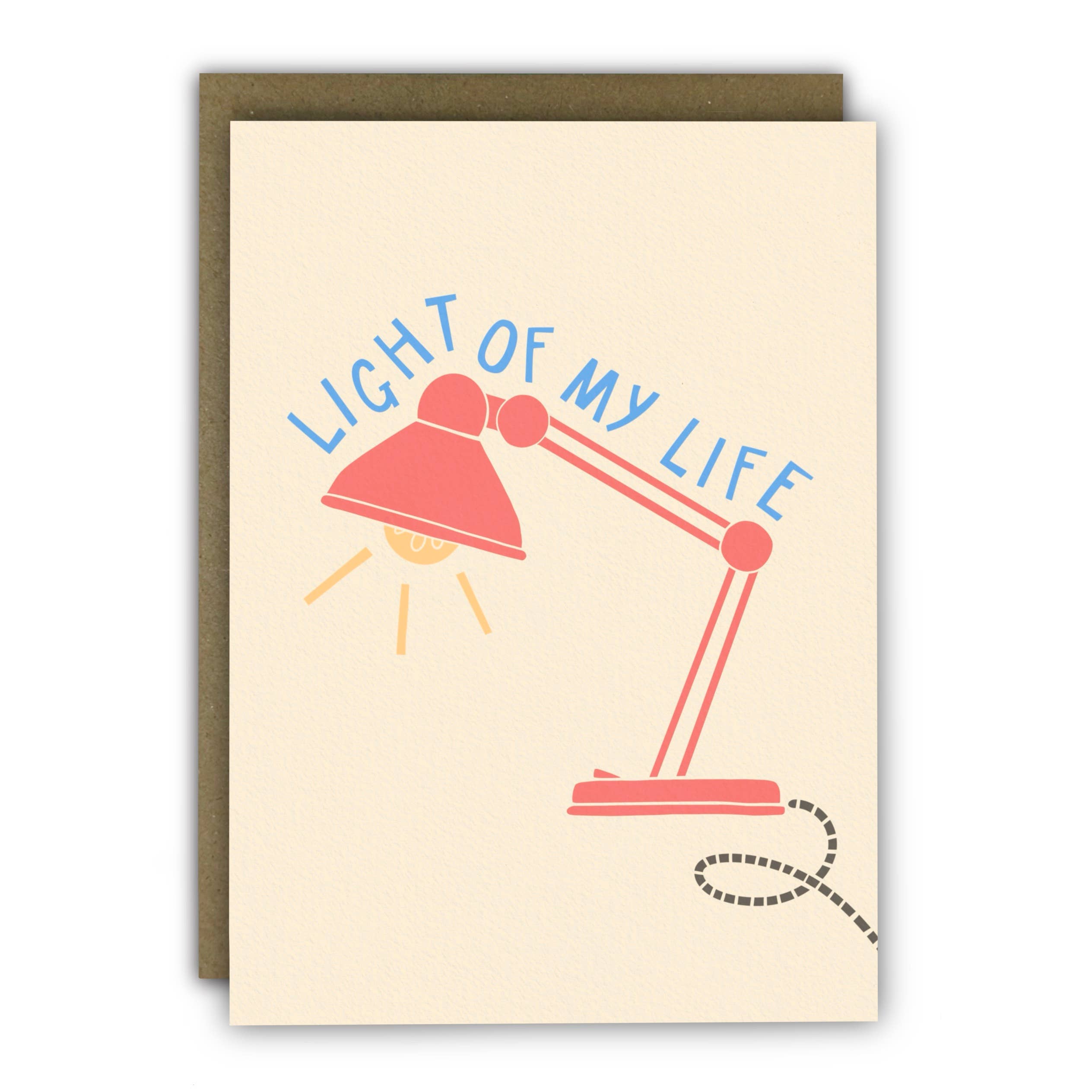 Modern anniversary card featuring a desk lamp illustration and the message "Light of My Life", printed on premium textured ivory cardstock with a kraft envelope.