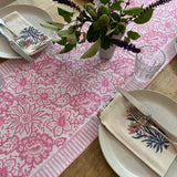 Soft pink block printed table runner on styled dining table