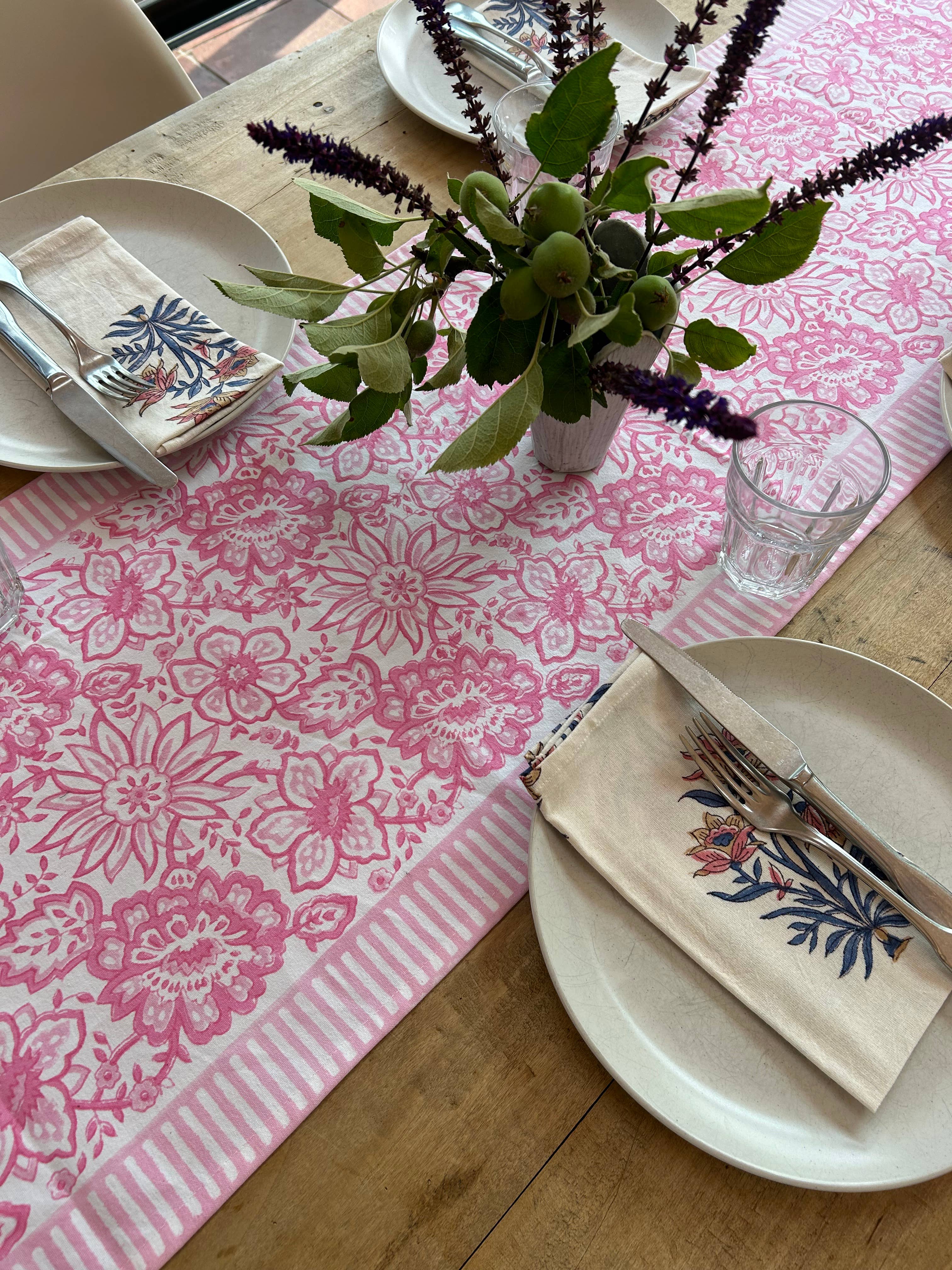 Soft pink block printed table runner on styled dining table