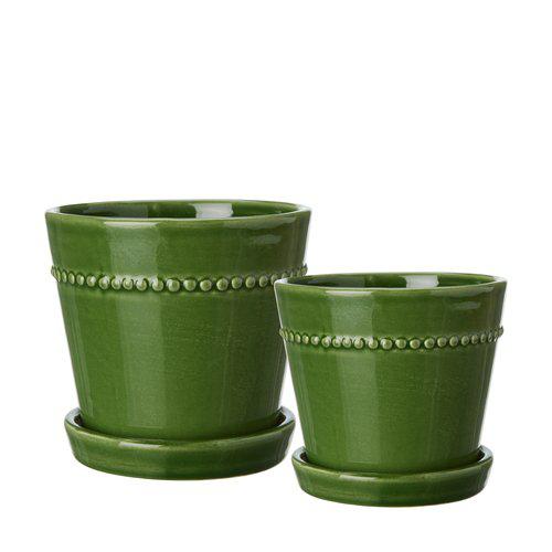 Two green ceramic planters with decorative beads on a white background