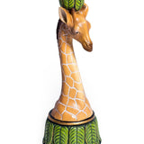 A candlestick designed with a giraffe motif, featuring leaf patterns on the base and a giraffe's head as the holder.