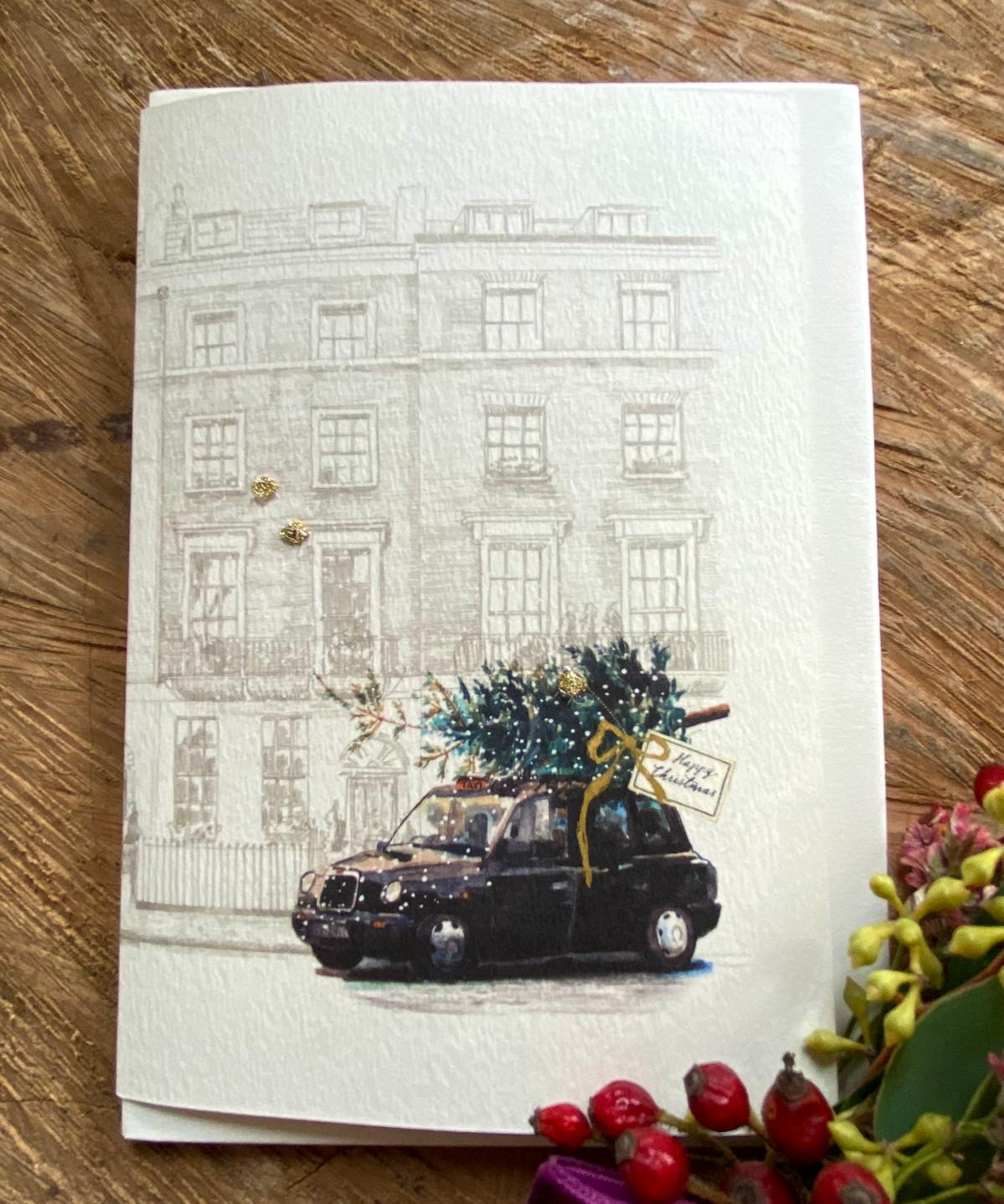 Handmade Black Cab Christmas Tree card featuring original artwork by Elena Deshmukh, individually hand stitched on premium textured cardstock.