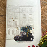Handmade Black Cab Christmas Tree card featuring original artwork by Elena Deshmukh, individually hand stitched on premium textured cardstock.