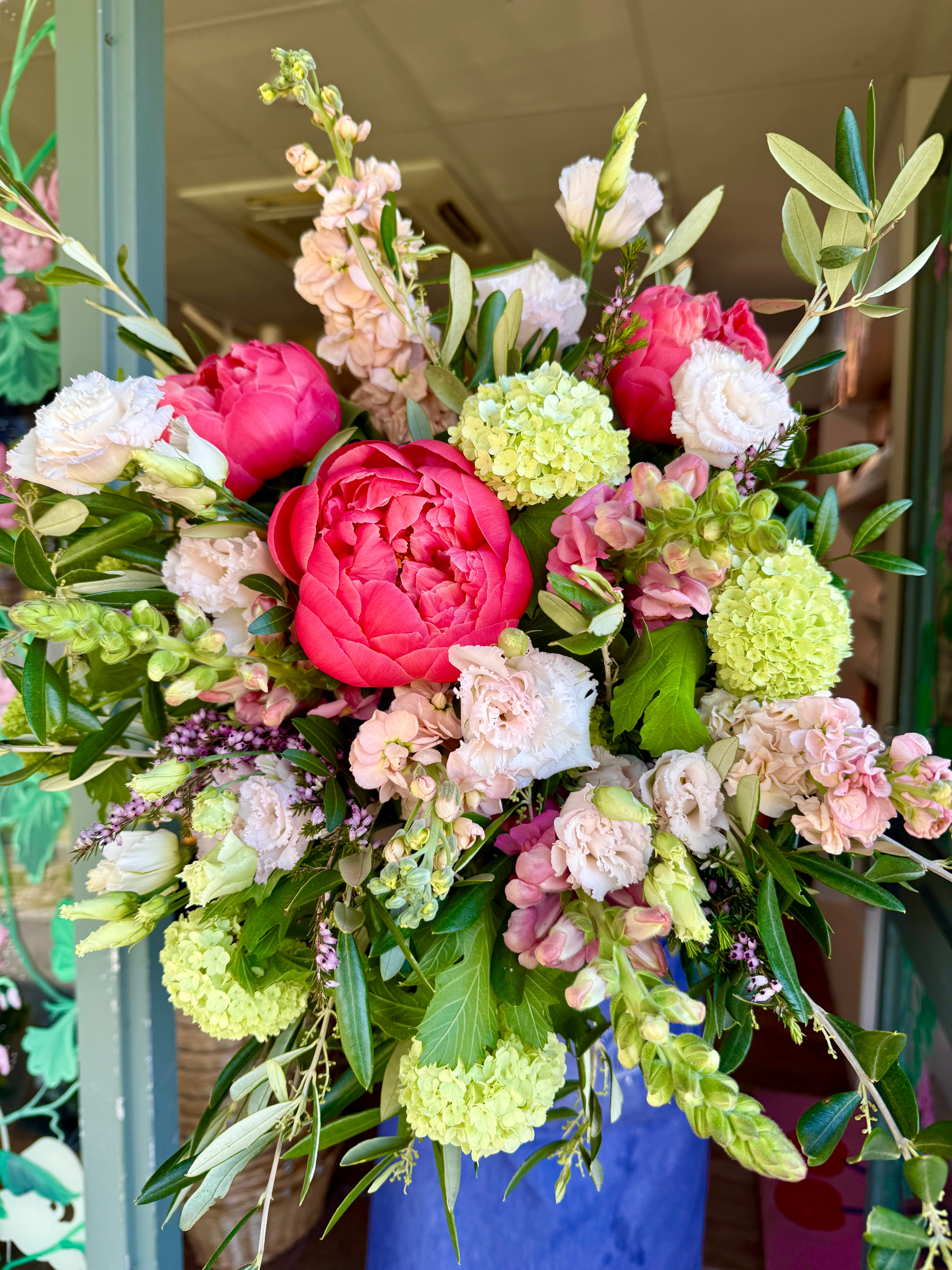 Watermelon & Mint bouquet featuring Coral Charm peonies, blush pink lisianthus, snapdragons and fresh green viburnum.