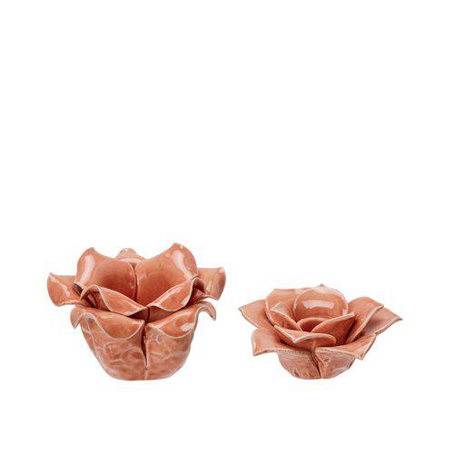 Porcelain candleholders in apricot color, designed to resemble flowers
