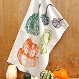 Tea towel with autumnal design of pumpkins and gourds 
