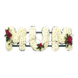 MUM funeral flower letter tribute handcrafted by Mad Lilies in Banstead, Surrey, featuring beautiful seasonal flowers in a personalised floral arrangement.