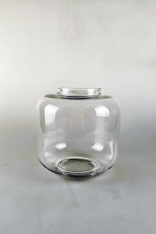 Mad Lilies Signature Glass Belly Vase, a 20cm clear glass vase perfectly shaped for hand-tied bouquets and fresh seasonal flowers.