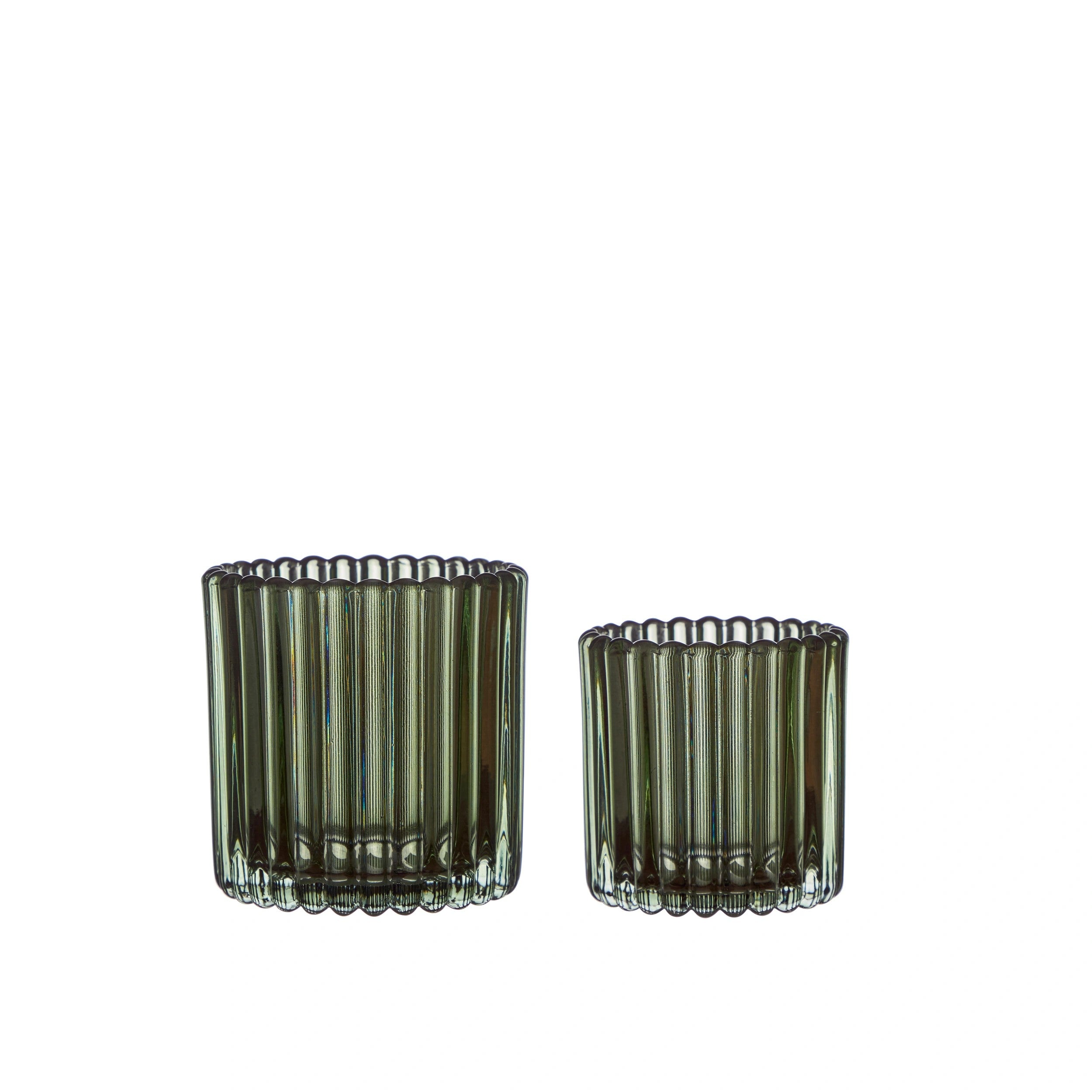 green ribbed candle holders with a clear ribbed design allowing light to pass through