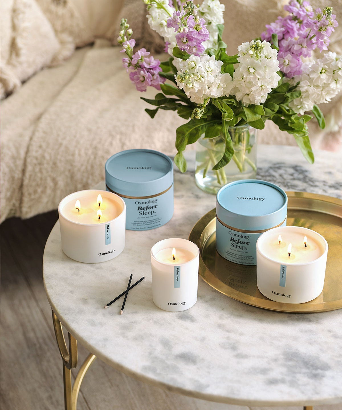 Relaxing lavender candle styled in bedroom for calming evening routine