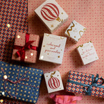 festive pine candle presented in a beautifully illustrated box