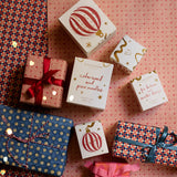 festive pine candle presented in a beautifully illustrated box
