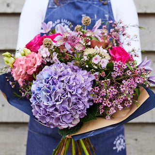 The Lilac Hour bouquet featuring lilac hydrangeas and seasonal pink summer flowers hand-tied by Mad Lilies.