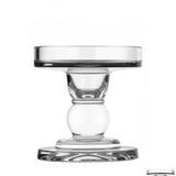 A clear glass candle holder with a sleek design