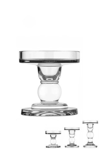 A clear glass candle holder with a sleek design