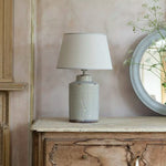 rustic, textured ceramic base in soft neutral tones