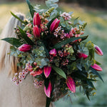 Fragrant pink Oriental lily bouquet with seasonal flowers and fresh foliage in a natural garden-inspired style.