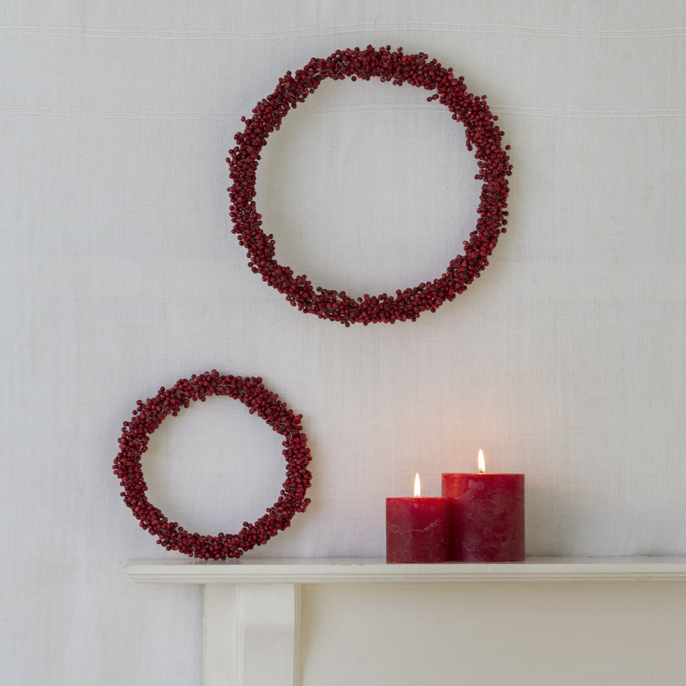 Clusters of red wooden beads reminiscent of winter berries