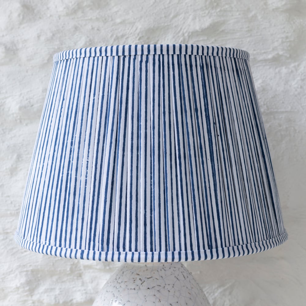 Hand block printed pleated cotton lampshade in navy blue and white stripe design handcrafted by Indian artisans.