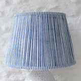 Hand block printed pleated cotton lampshade in navy blue and white stripe design handcrafted by Indian artisans.