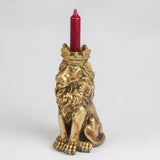 Antique gold lion candlestick holder featuring a crowned lion design, perfect for taper candles and statement home décor styling.