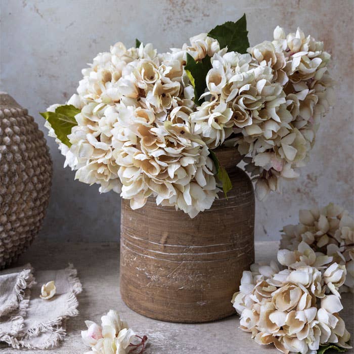 Abigail Ahern Faux Hydrangea Morning Mist artificial flower stem featuring realistic hand-painted petals in soft neutral tones for luxury home styling.