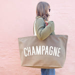 Alphabet Bags REALLY Big Champagne Bag oversized cotton canvas tote with bold typography, handmade in the UK and ideal for picnics, shopping and carrying champagne.
