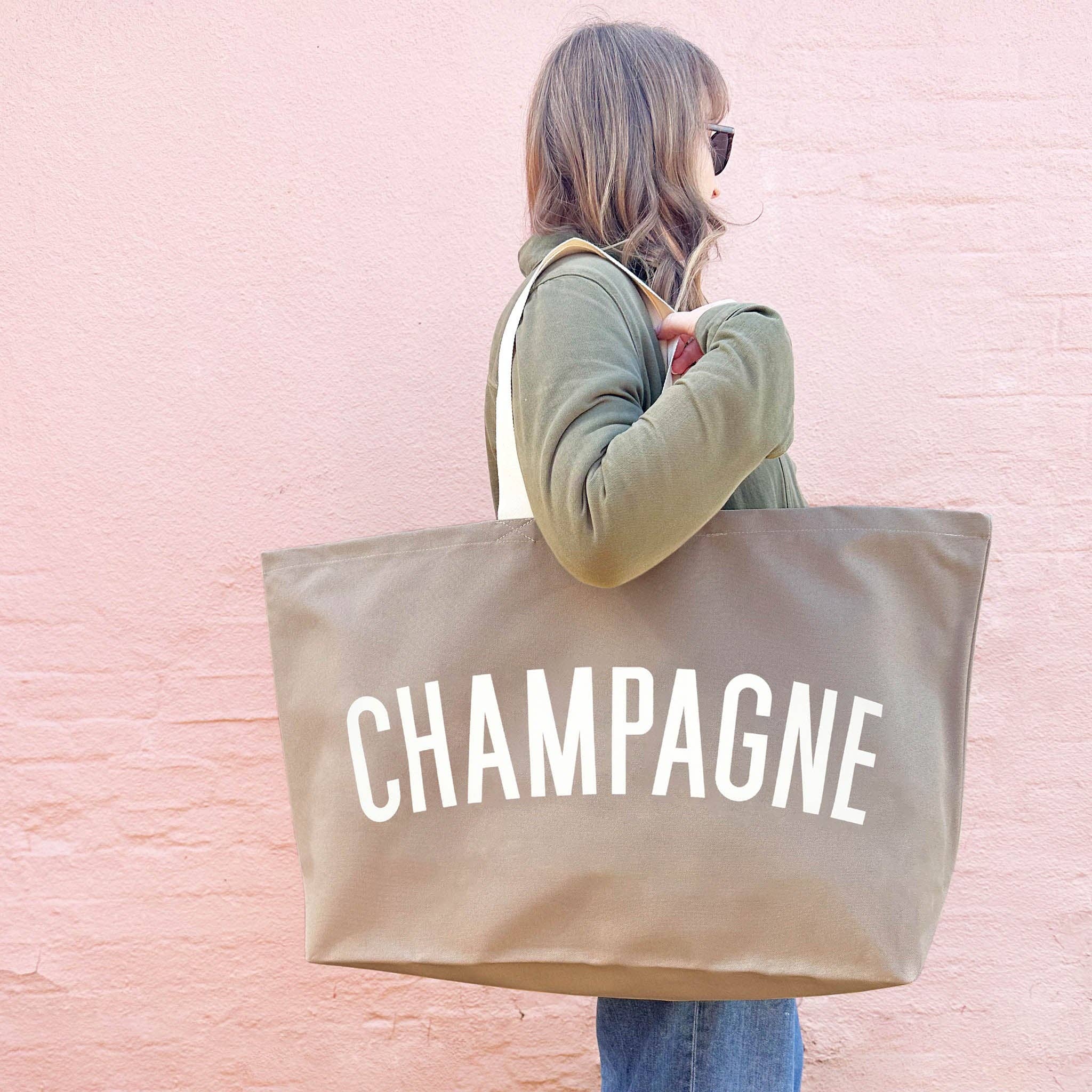 Alphabet Bags REALLY Big Champagne Bag oversized cotton canvas tote with bold typography, handmade in the UK and ideal for picnics, shopping and carrying champagne.