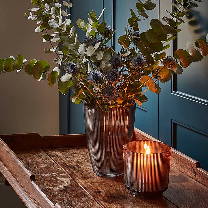 Amber ribbed glass candle holder in a warm amber finish, perfect for tealights and cosy autumn home styling.