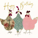 Anna Wright Happy Birthday Hens greeting card featuring three cheerful hens with gold foil detailing and the handwritten message "Happy Birthday" on premium FSC®-certified card.