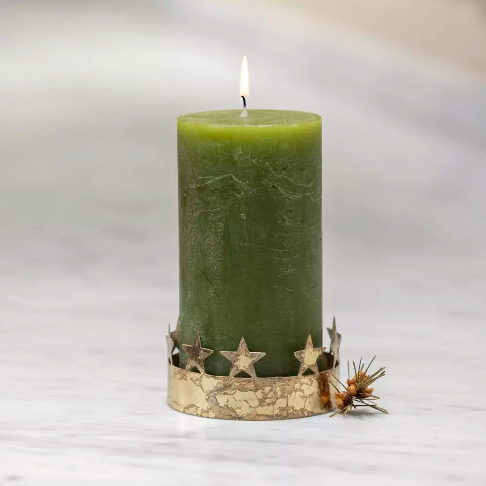 Antique gold pillar candle holder with decorative star cut-out crown detail