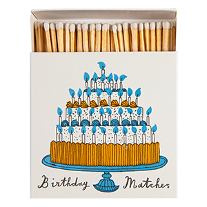 Archivist Birthday Matches luxury square matchbox featuring Charlotte Farmer's illustrated four-tier birthday cake with blue candles and 125 safety matches.
