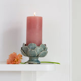 Sage green sculptural artichoke pillar candle holder with layered leaf detail