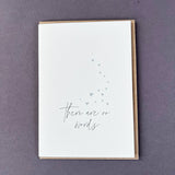 Penguin Ink There Are No Words letterpress sympathy card featuring metallic silver hearts and modern calligraphy, printed on 100% recycled board with a tactile embossed finish.