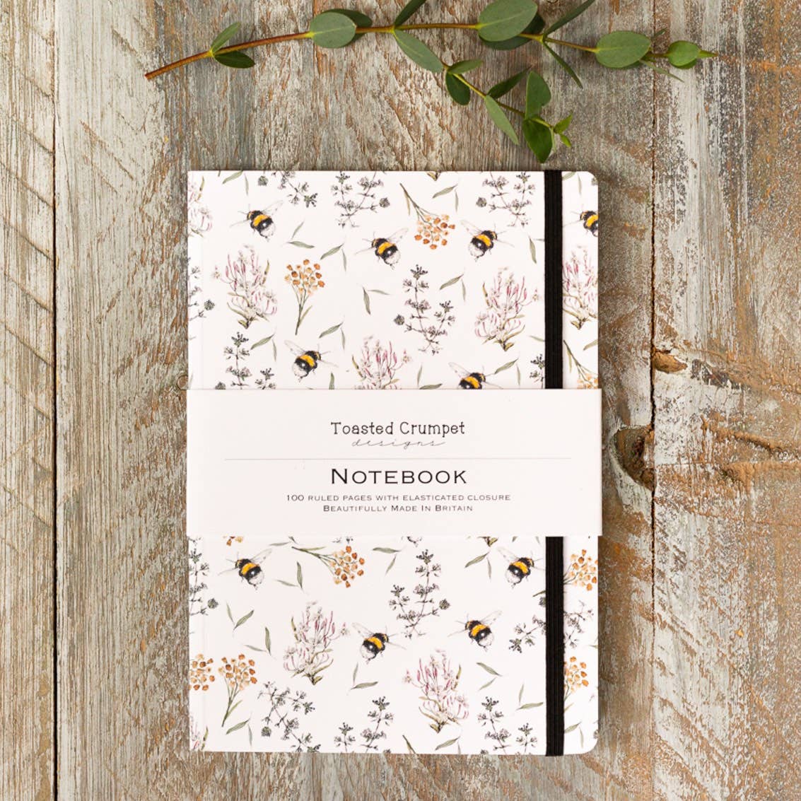 Beautiful A5 lined notebook featuring an elegant bees and honeysuckle design. Perfect for journalling, planning, note-taking and thoughtful gifting.