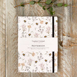 Beautiful A5 lined notebook featuring an elegant bees and honeysuckle design. Perfect for journalling, planning, note-taking and thoughtful gifting.