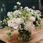 A luxury vase arrangement with premium roses and seasonal summer flowers in soft ivory, blush and cream tones. Beautifully arranged by Mad Lilies.