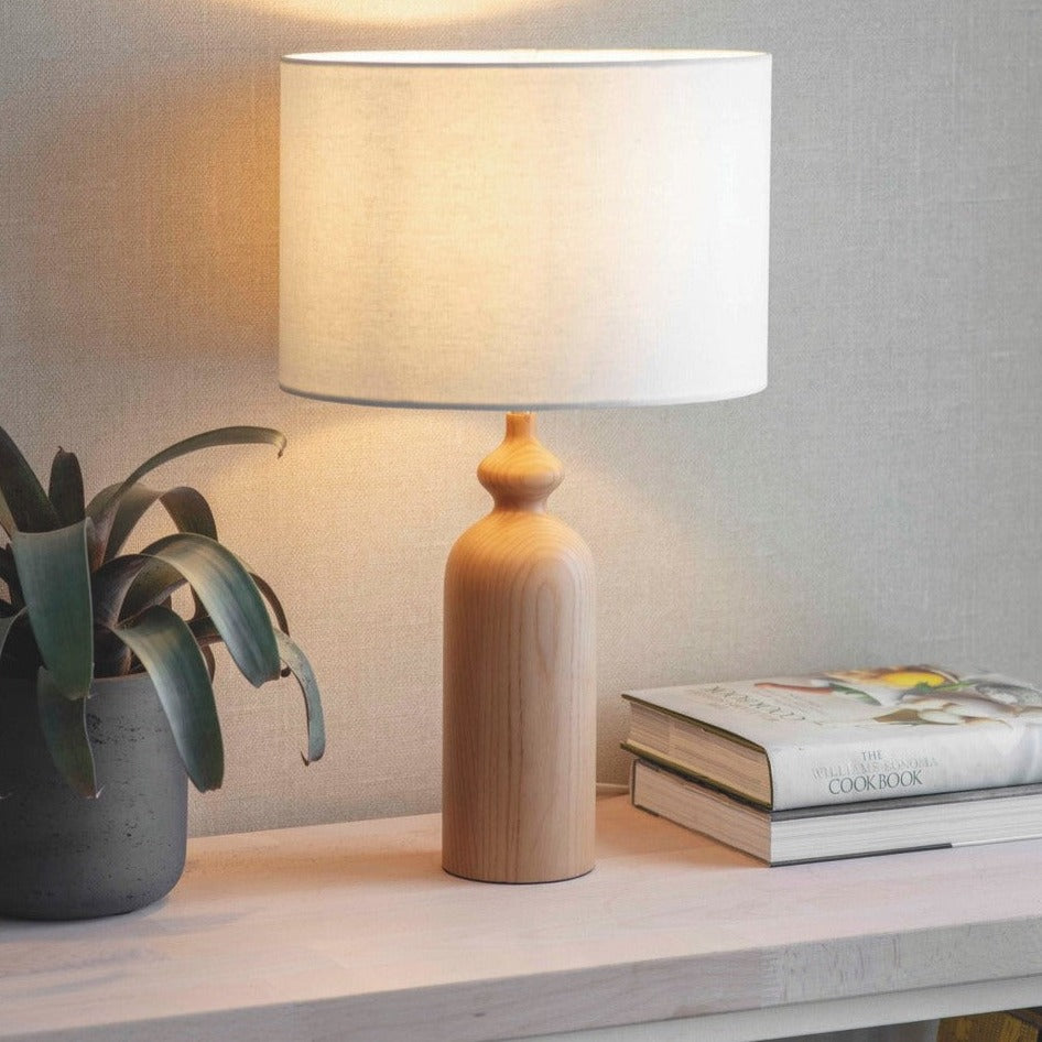 Bloomsbury Ash Table Lamp with Lily White drum shade and sculptural wooden base.